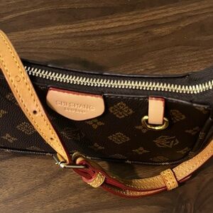 Brown Patterned Bag with a real leather strap from Dooney Burke. Great teen bag